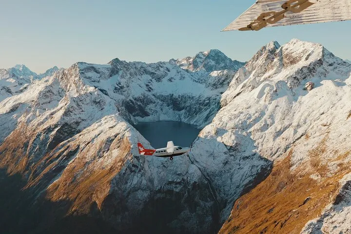 Fixed-wing aircraft landing near Milford Sound on a fly and cruise boat tour from Queenstown in New Zealand