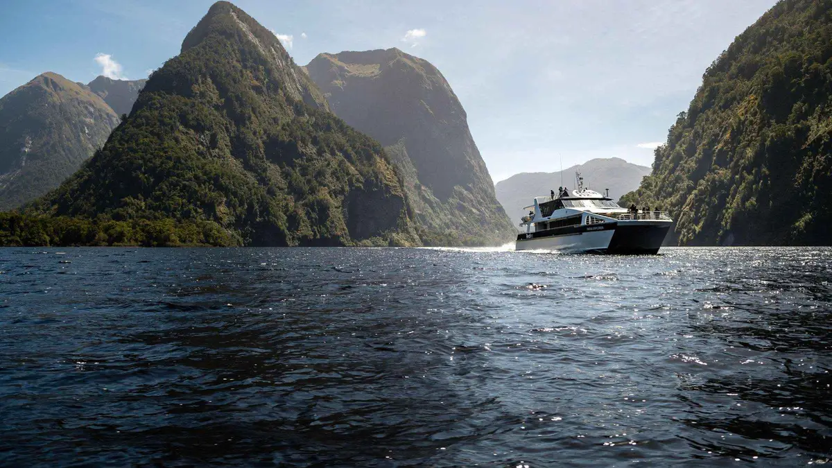 Catamaran in the quiet water of a Doubtful Sound cruise from Manapouri in Fiordland, New Zealand