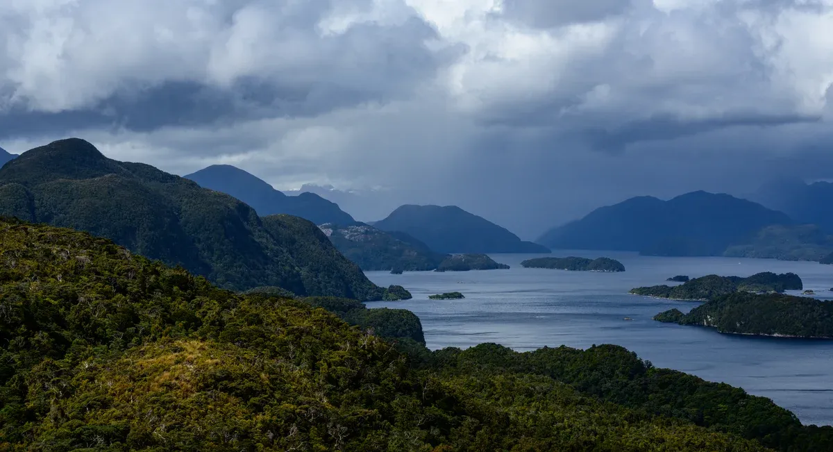 Islands and forested ridges of Dusky Sound in Fiordland National Park, far from the Milford Sound cruise crowds.