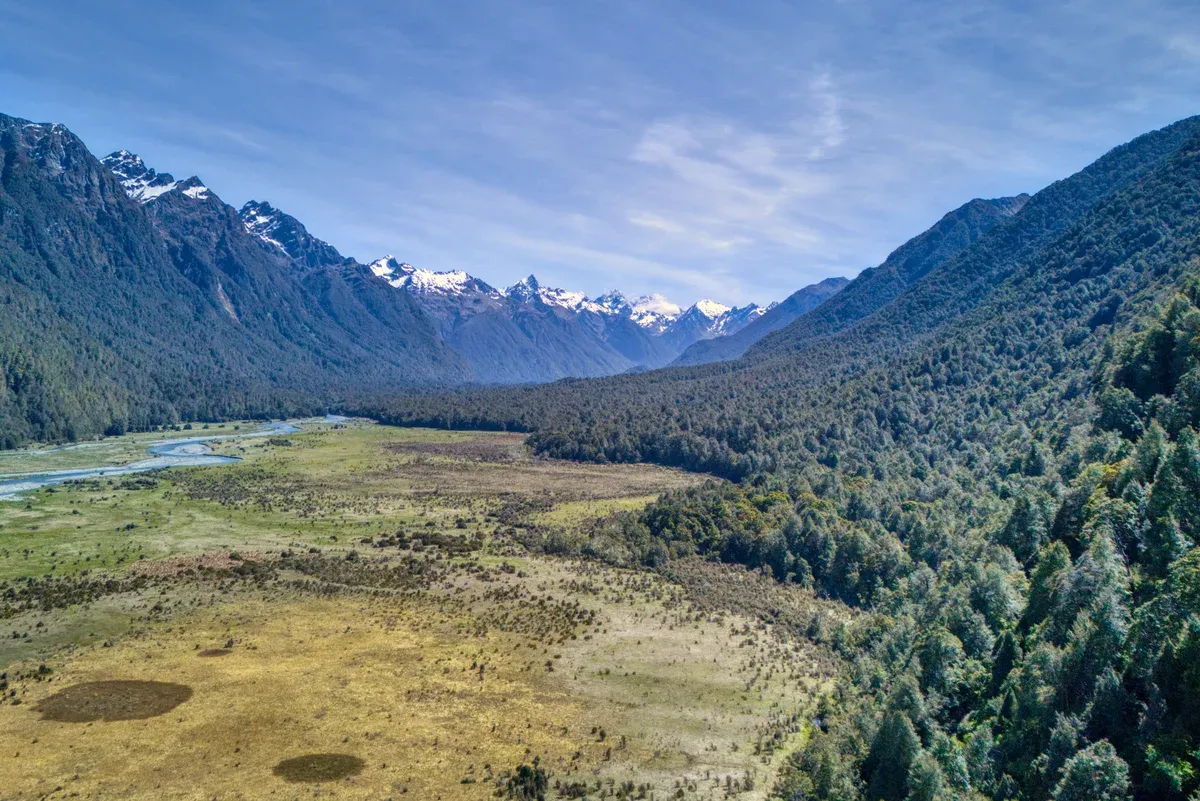 Eglinton Valley flats and ranges seen on the drive to a Milford Sound boat tour